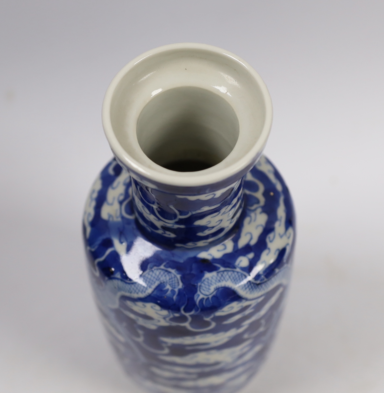 A Chinese blue white ‘dragon’ rouleau vase, Kangxi mark, late 19th century, 21cm high